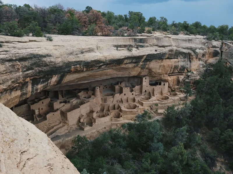 Ancient cliff dwellings tucked beneath a sandstone overhang at Mesa Verde National Park in Colorado