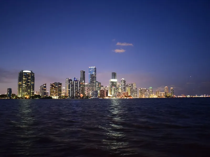 Miami skyline lit at dusk across Biscayne Bay