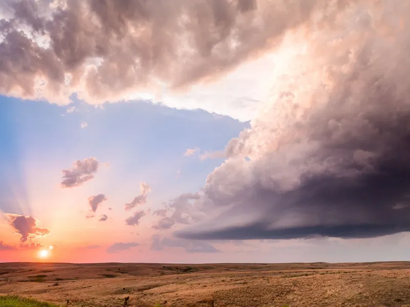 Storm clouds and a glowing sunset over the Kansas prairie