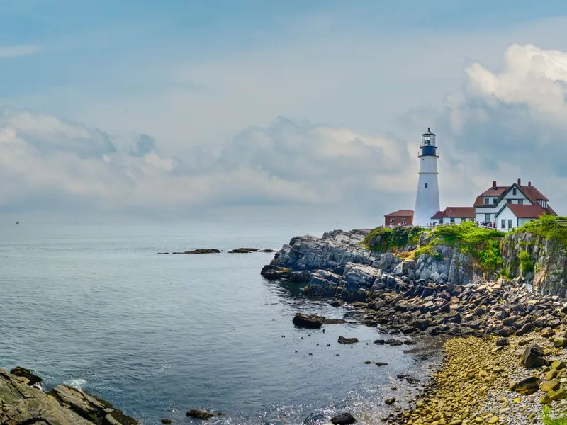Panorama of Portland Head Light on the rugged Maine shoreline