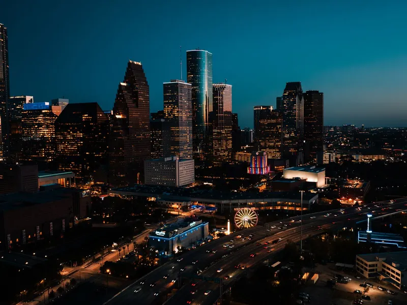 Downtown Houston skyscrapers lit at dusk