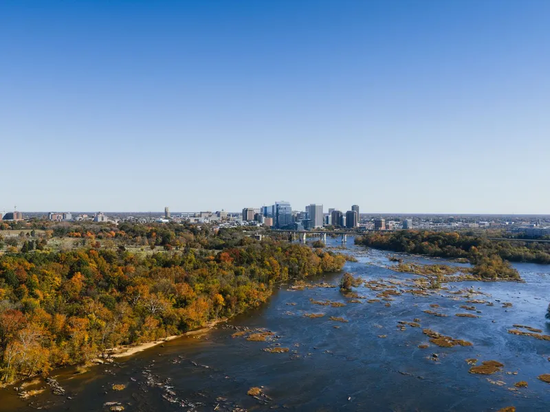 Richmond, Virginia skyline beyond the James River and fall foliage