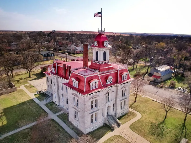 Historic Chase County Courthouse in Cottonwood Falls, Kansas, with its red mansard roof and clock tower