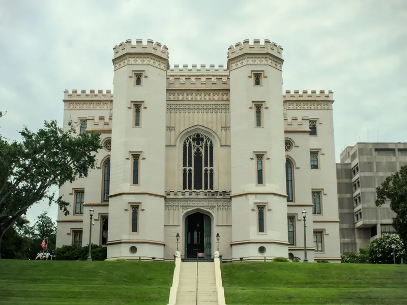 Gothic-style Old State Capitol in Baton Rouge, Louisiana, with crenellated towers above a green lawn