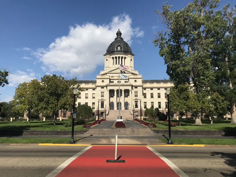 South Dakota State Capitol in Pierre, a domed limestone building seen from across the street