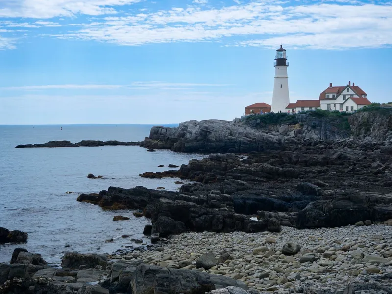 Portland Head Light lighthouse standing above the rocky shoreline in Cape Elizabeth, Maine
