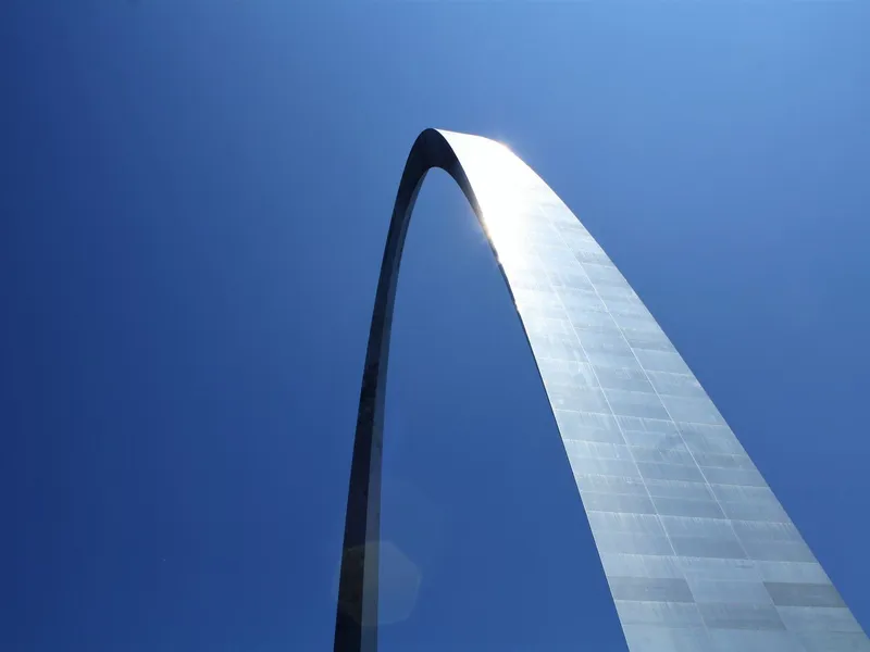 Gateway Arch in St. Louis rising against a clear blue sky